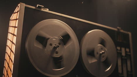 a vintage tape recorder in a pulsing light