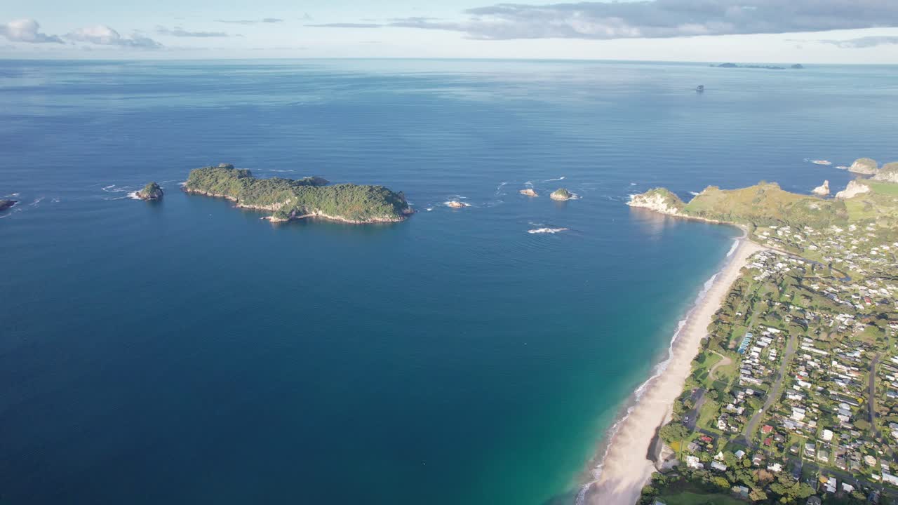 Aerial View of a Scenic Coastal Landscape with Beach, Ocean, and Islands