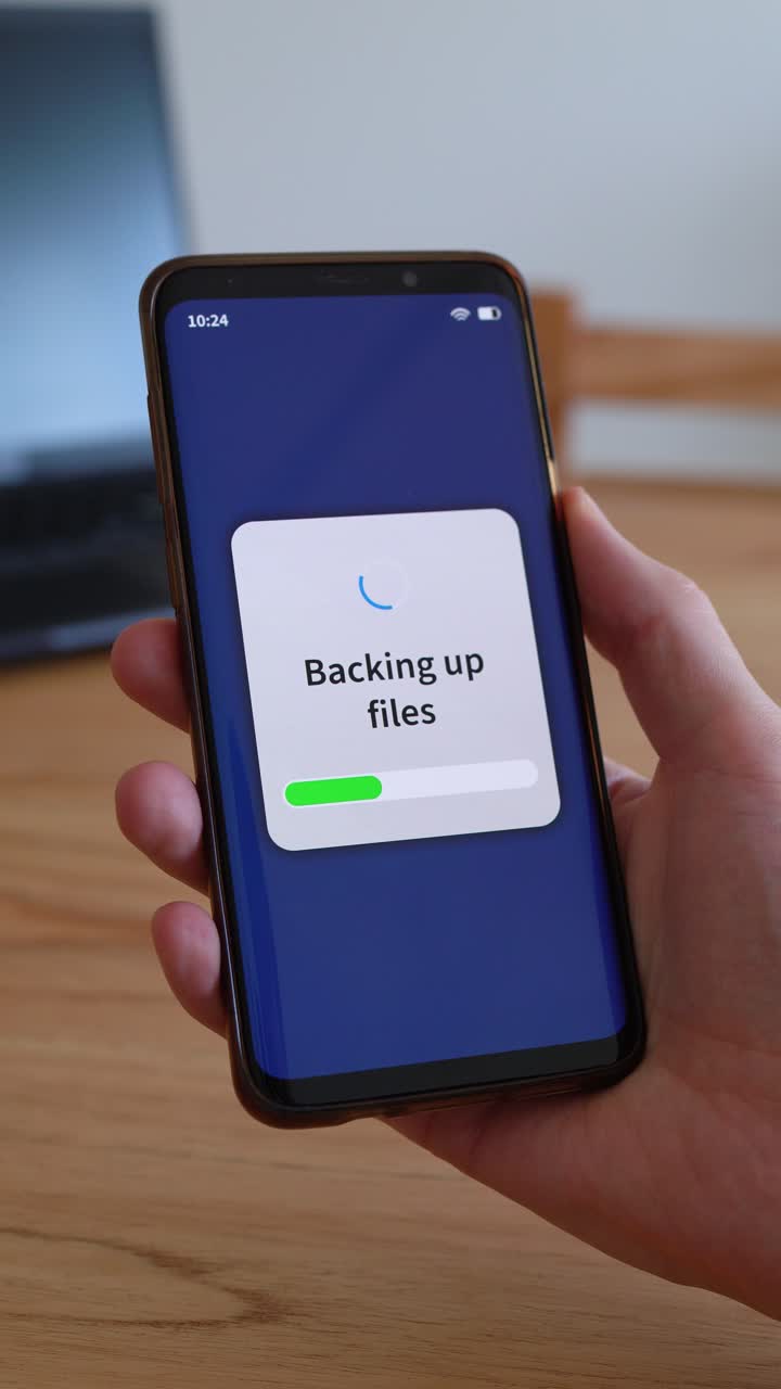 Backing up smartphone files on cloud storage. Concept of backup. Vertical shot
