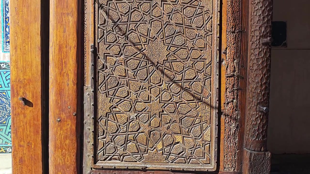 Intricate Carved Wooden Door with Traditional Islamic Geometric Patterns