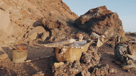 woman taking a bath in post apocalyptic world