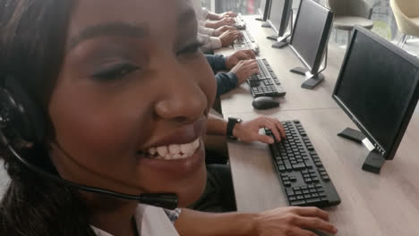 Portrait-of-female-business-executive-smiling-while-working