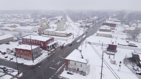 Old-grain-elevator-and-train-station-in-small-town-of-Michigan,-winter-season,-aerial-view