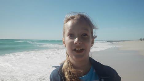 Young-girl-making-funny-faces-at-the-beach