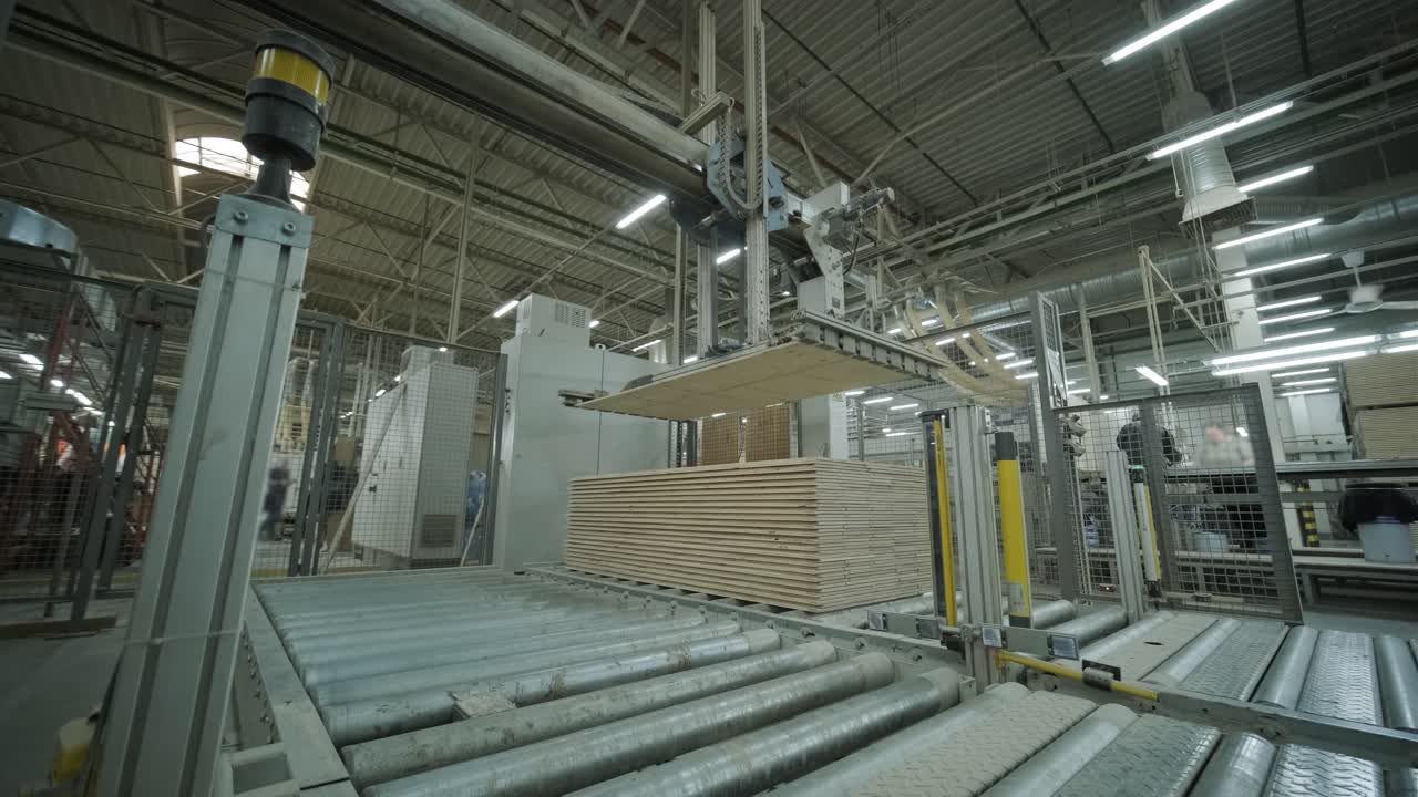Automated Robotic Arm Stacking Wood Panels in a Modern Factory