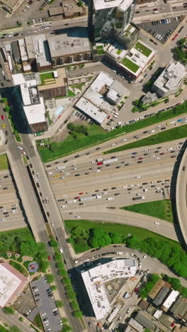 crazy flow of cars on the roads of chicago. transport moving in the busy area. beautiful sight of the city from birds perspective. vertical video