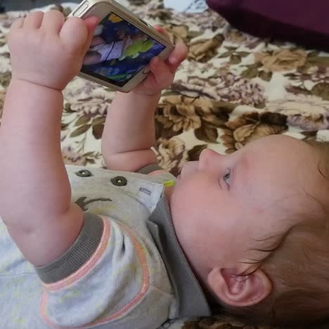 baby boy with smartphone