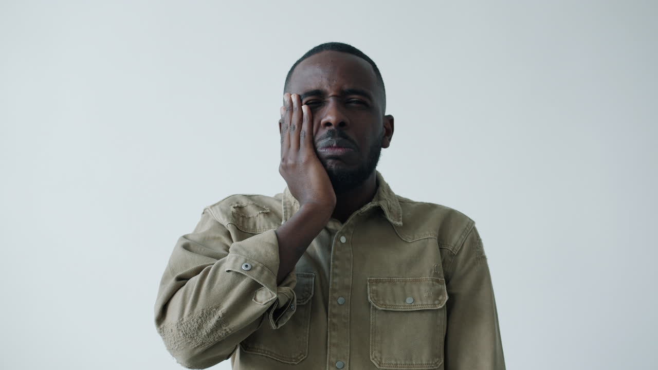 Man experiencing facial pain