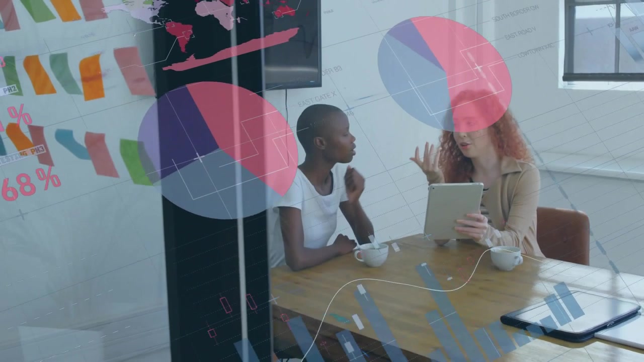 Animation of statistical data processing over two diverse women discussing over a tablet at office