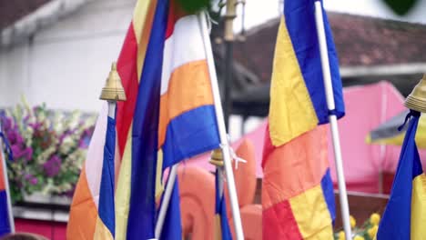 close up shot of buddhist flag on vesak day parade celebration in indonesia