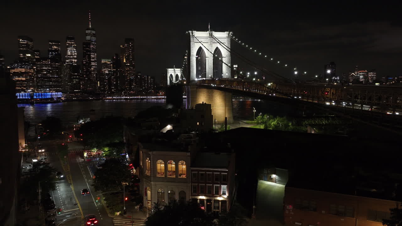 Aerial view of The Brooklyn Bridge at night. Shot during the summer of 2024 in 4k.