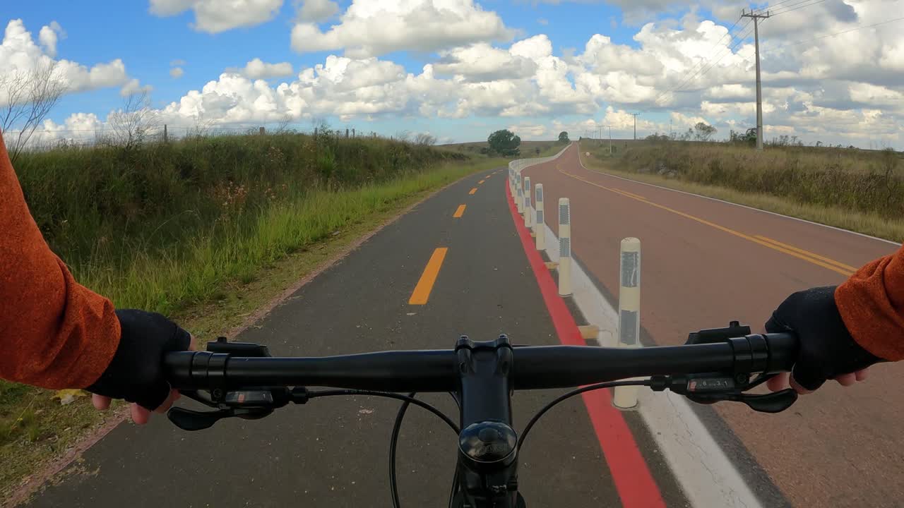 Cyclist riding safely on a cycle path with bicycle signs. FPV video
