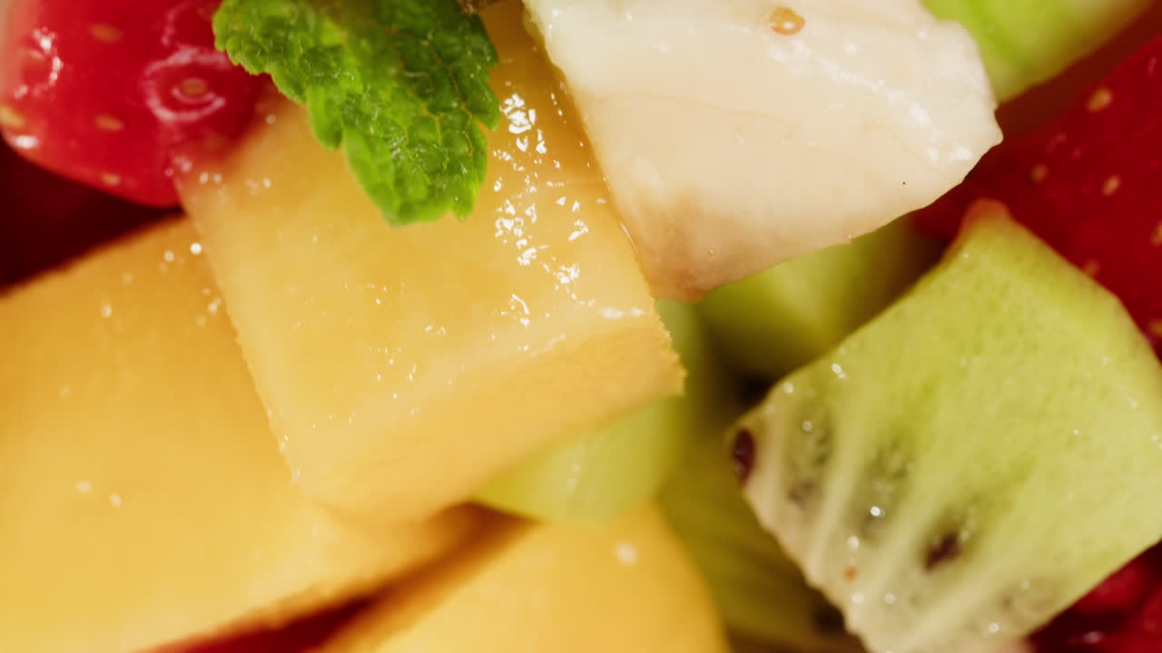 Close-Up of Fresh Diced Fruit Salad with Kiwi, Strawberry, and Melon