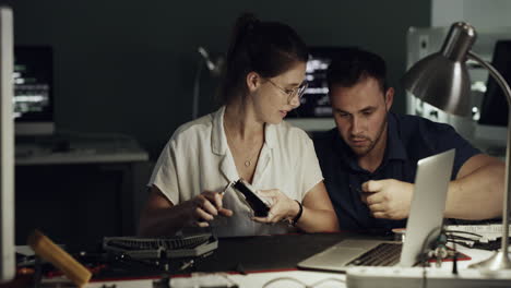 two young technicians repairing computer hardware