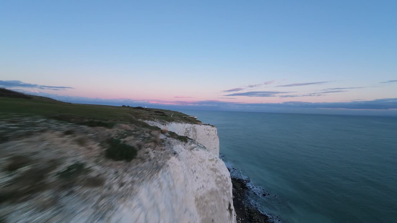 Natural geological wonders of the British coast, rock fromations at the sea. Carved and weathered by the elements over the milenia. FPV aerial action shots