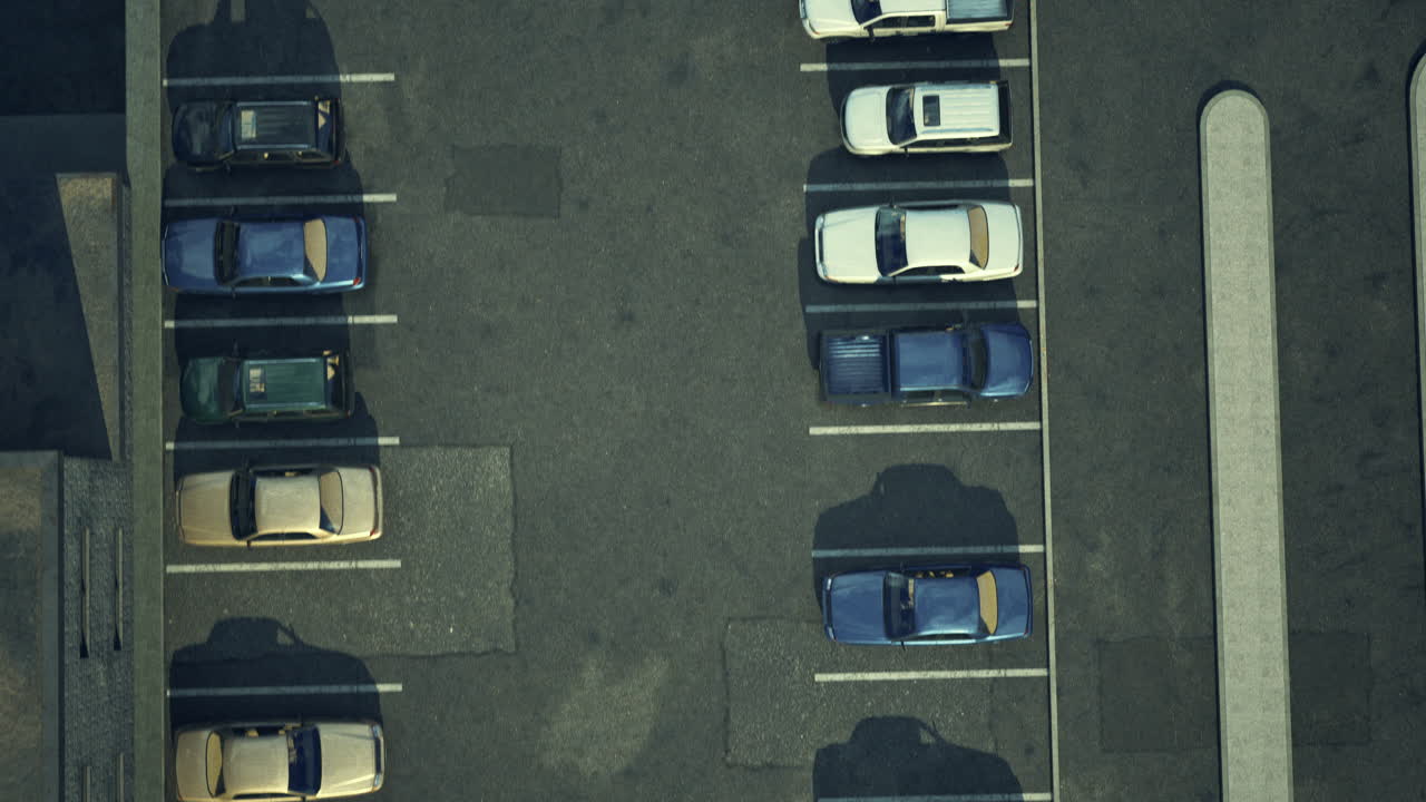 Birds eye view of a parking lot with various cars in daytime