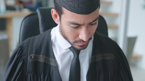 Muslim-man,-lawyer-and-reading-books-in-office