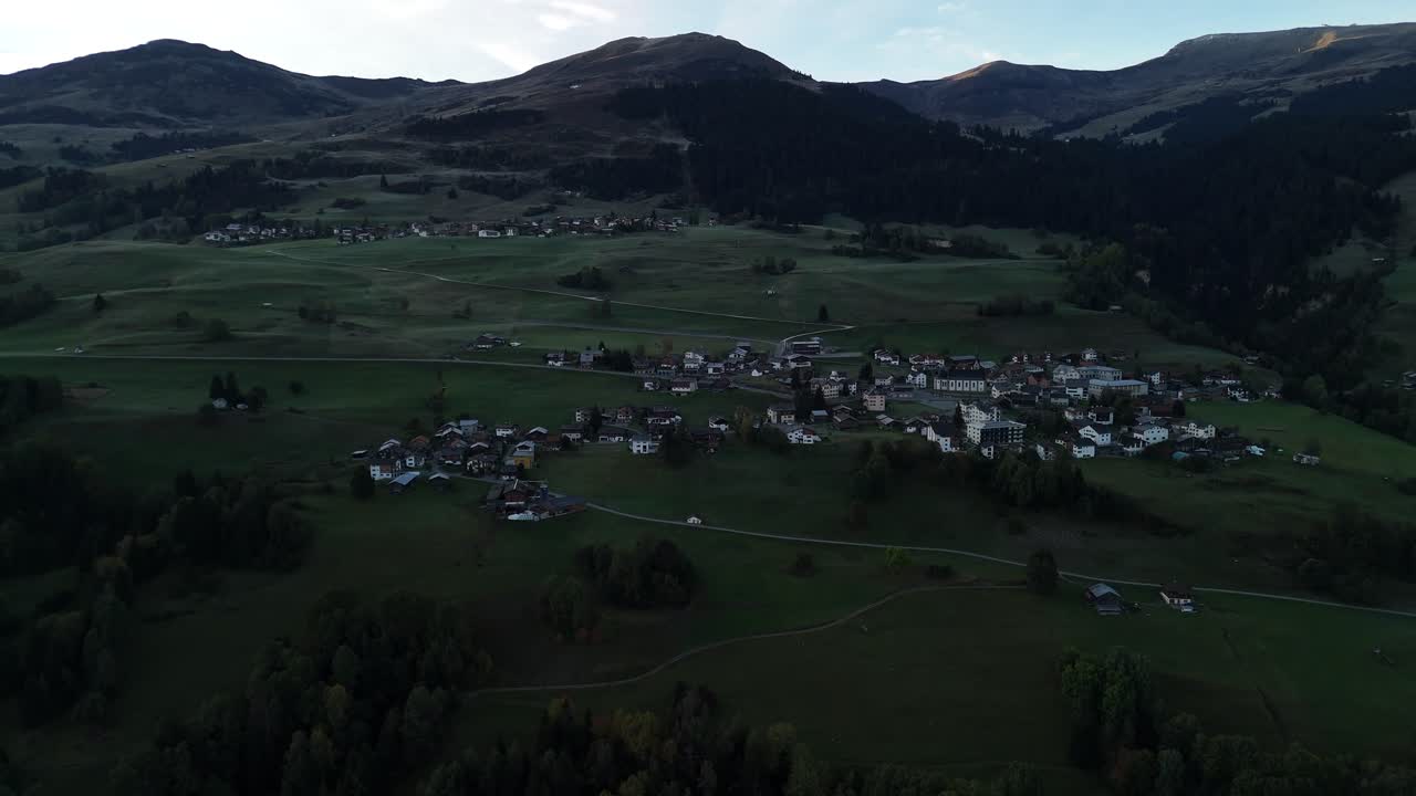 Village alpine Switzerland nature mountain valley, aerial drone isolated houses