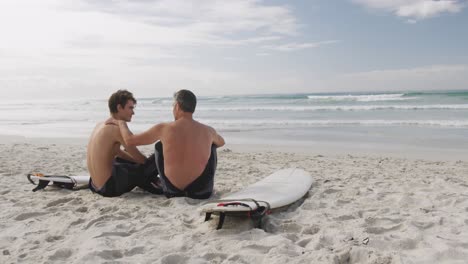 father and young adult son enjoying outdoor activities together