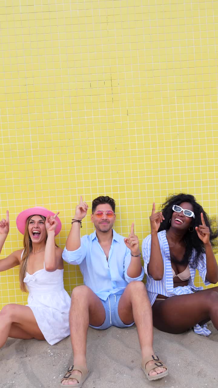 Friends enjoying summer vacation on the beach