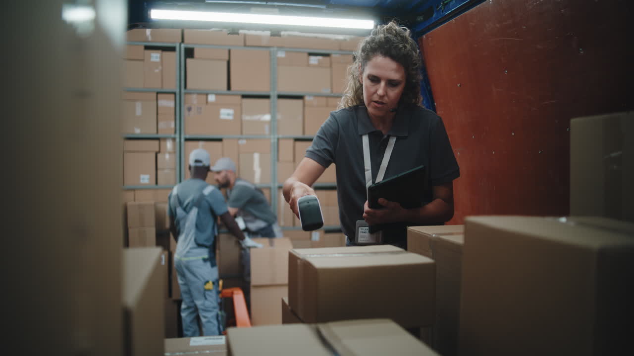 Logistics professionals managing inventory and packages in a busy warehouse