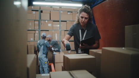 logistics professionals managing inventory and packages in a busy warehouse