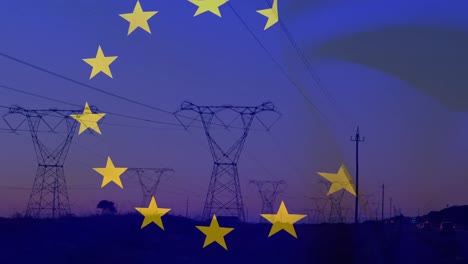 animation of european union flag over eletricity pylons in field at sunset
