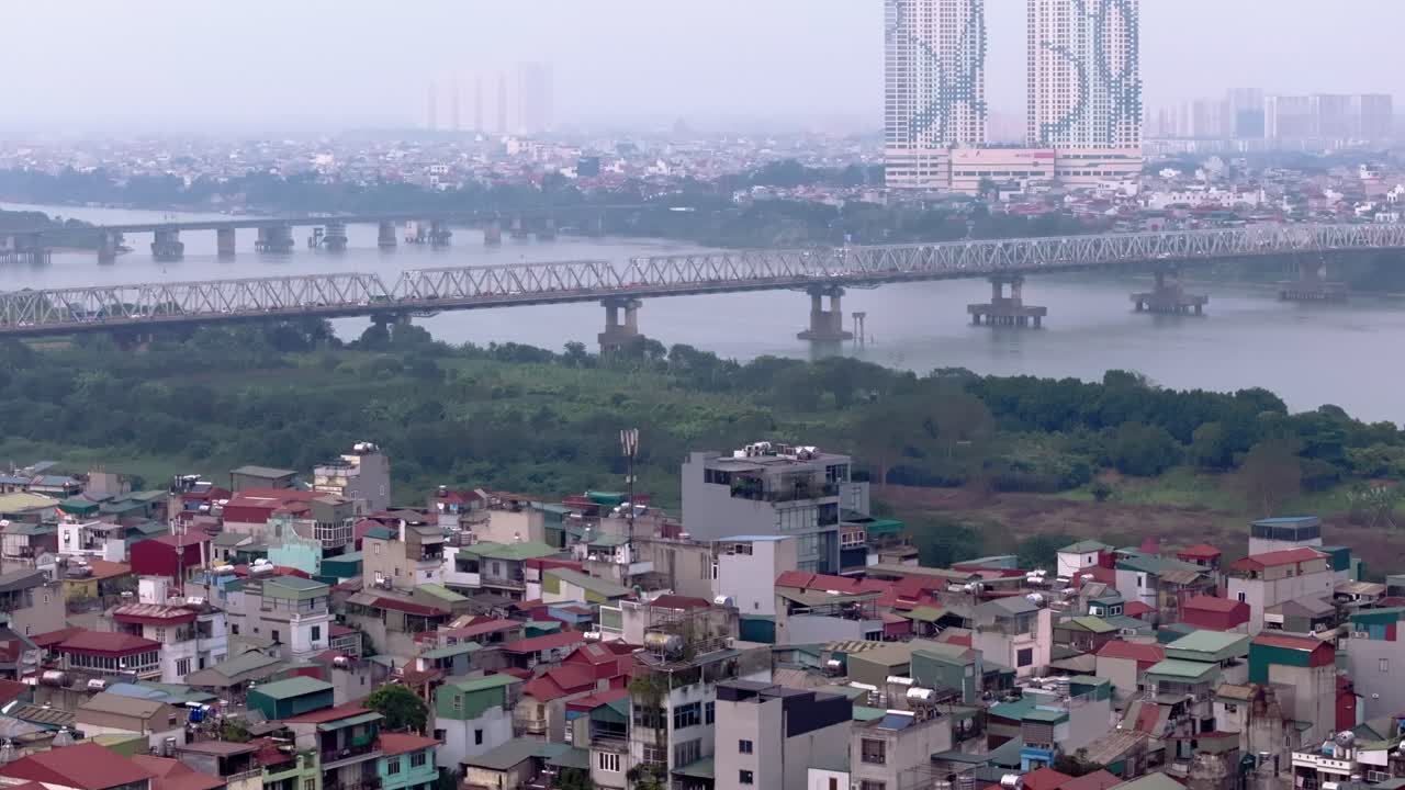 Aerial View of Hanoi Cityscape with Red River and Historic Bridges