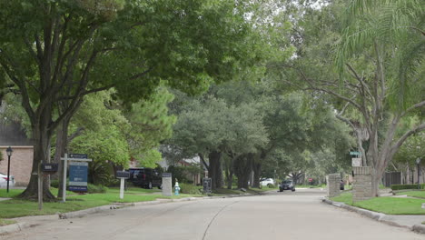 a quiet, tree lined, residential street in houston, texas