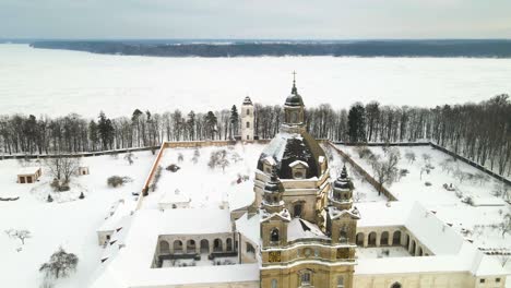 aerial view of the pazaislis monastery and the church of the visitation in kaunas, lithuania in winter, snowy landscape