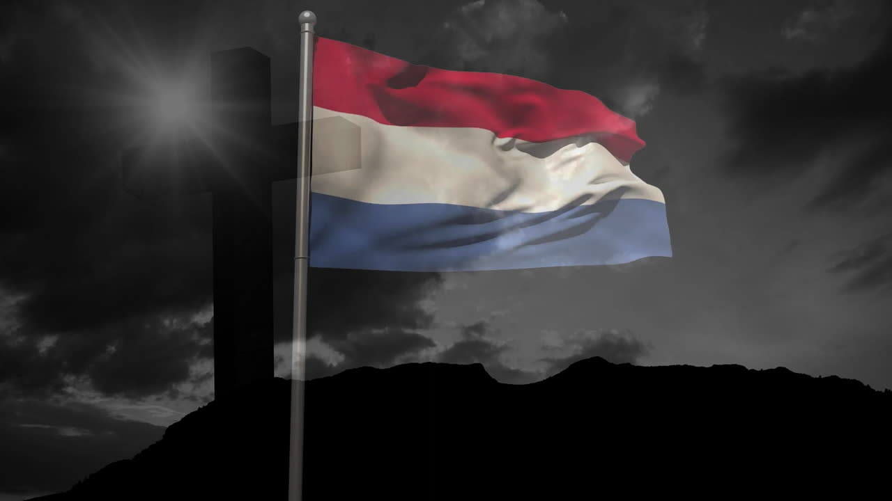 Waving Dutch flag with cross silhouette against dark sky background