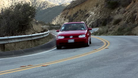 Motorcycle-and-cars-on-winding-mountain-road-4