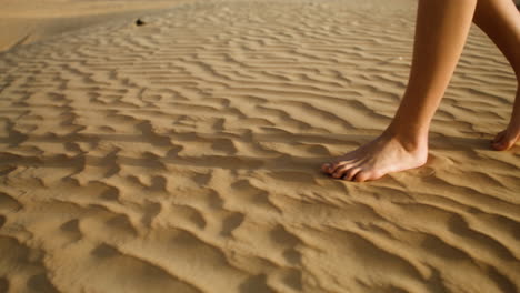 barefoot person on the sand