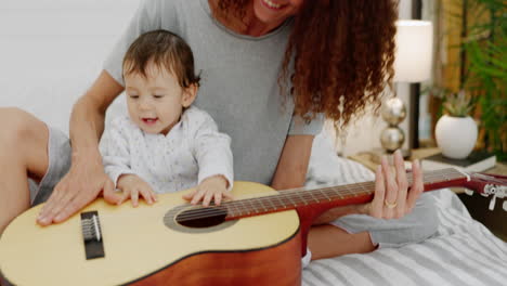 Mother,-girl-or-playing-guitar-in-bedroom-of-house