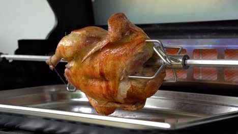 rotisserie chicken is grilled with a rear burner