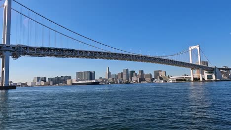 view on the famous rainbow bridge in tokyo above the bay of sumida river and toyko