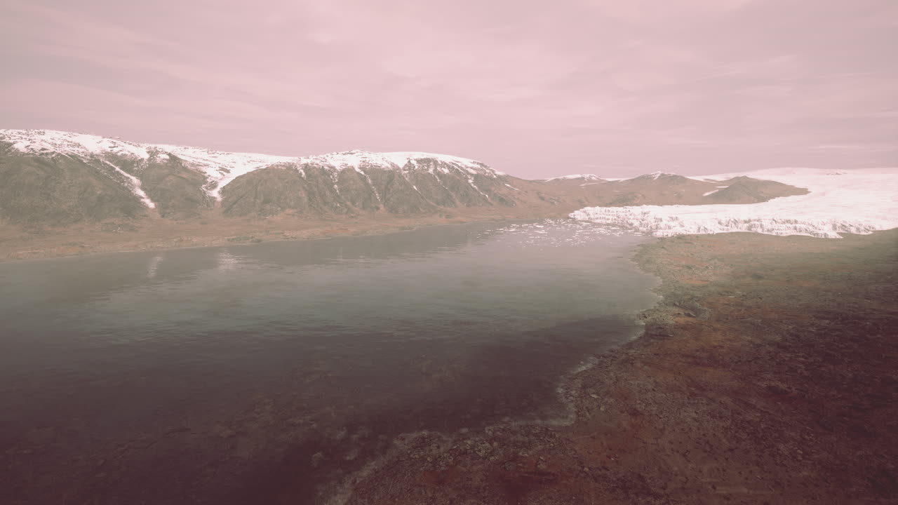 snowy mountains and drifting icebergs in the Greenland Sea
