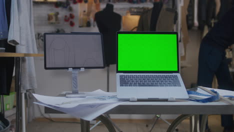 fashion design studio with laptop and tablet