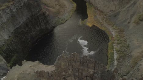 a drone view right above the waterfall of palouse fall in washington