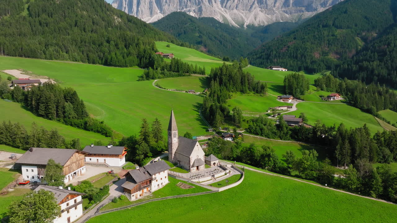 St Magdalena Church anchors vibrant green Val di Funes with sharp Dolomite peaks rising
