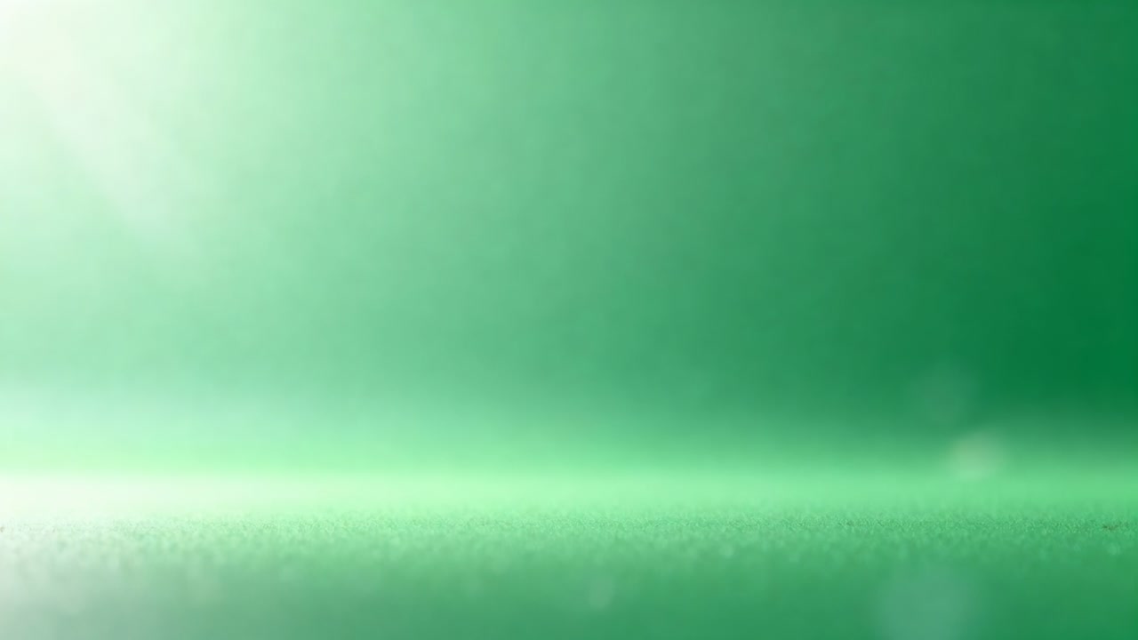 Brightening studio green set with top-left light brightening, revealing horizon and drifting bokeh
