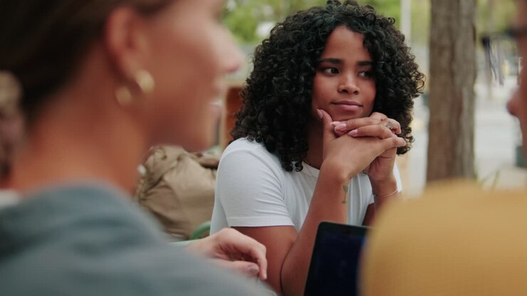 Top view of a diverse group of students using laptop or modern technologies