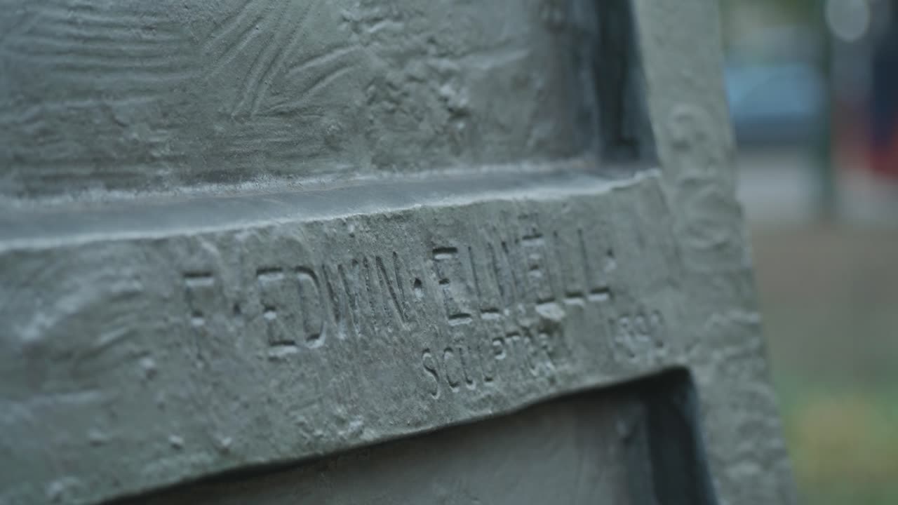 Close-up of Edwin Elwell Sculpture Inscription