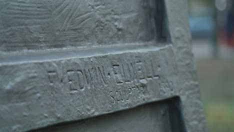 close-up of edwin elwell sculpture inscription