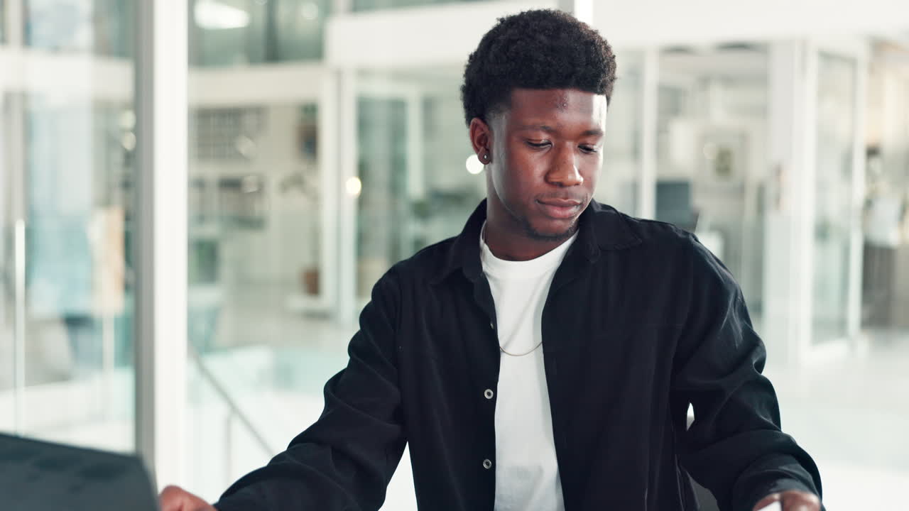 Young African American man working in a modern office