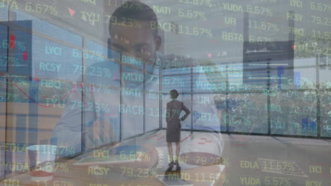 animation of statistics processing over businesswoman and businessman using tablet