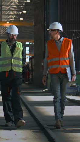 factory workers discussing