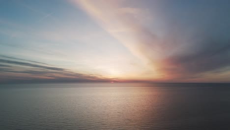 Beautiful-Aerial-Establishing-View-of-Baltic-Sea-Coast-on-a-Sunny-Evening-at-Bernati,-Latvia