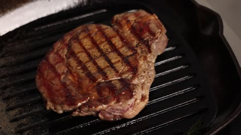 cooking a steak in a pan