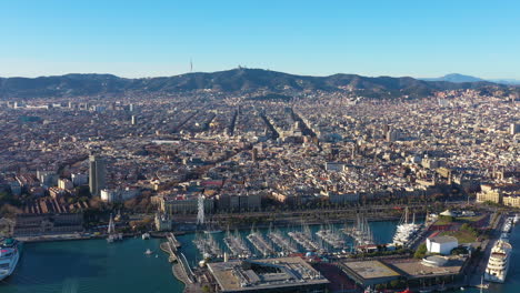 sunset over barcelona gothic quarter aerial harbour and mountains spain